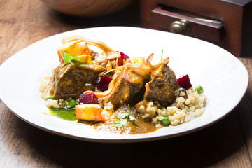 A plate of calf cheeks on a table
