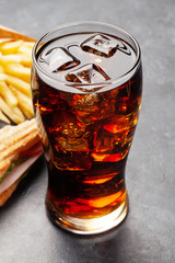 Glass of cola, club sandwich and potato fries chips
