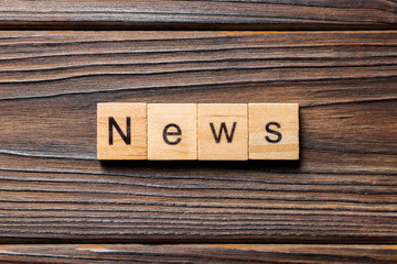 news word written on wood block. news text on table, concept