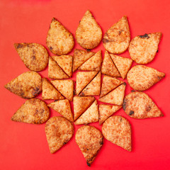 Rosy crackers on red background