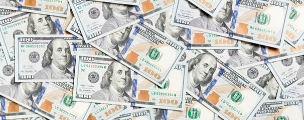 Top view of one hundred dollar banknotes made as a background. USD currency concept. Texture of American dollars