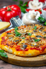 Pizza with mushrooms and cheese. Italian cuisine.