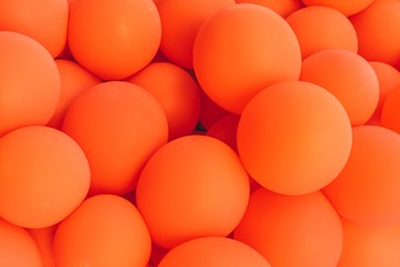 Pastel orange color balloons background
