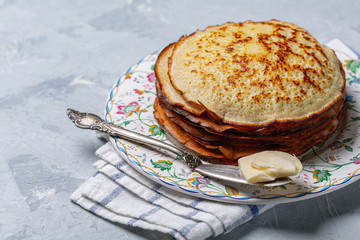 Wheat pancakes with butter.