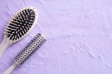 two combs lie on a textured background