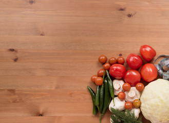 vegetables tomatoes, peppers, cabbage, mushrooms on a wooden background. healthy, diet  food.