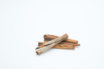 Cinnamon or Cinamon shot on a white isolated background.
