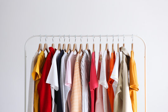 fashion clothes on a stand in a light background indoors. place for text
