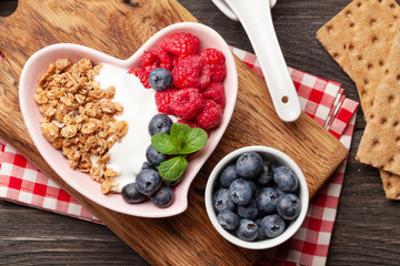 Healthy breakfast with granola, yogurt and berries