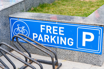 White blue bicycle parking road sign and free stop places.