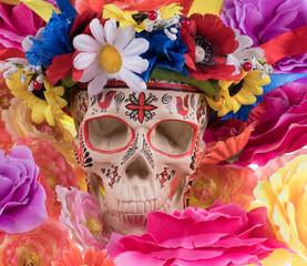 Mexican Day of the Dead,colorful skull on a background of flowers