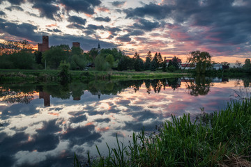 Castle and Czerskie lake at sunset in Czersk, Poland