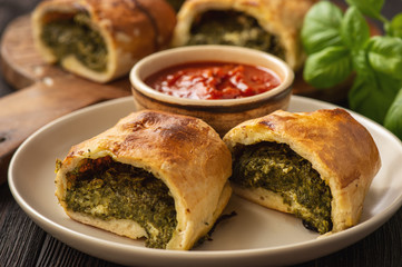 Stromboli with spinach and mozzarella fiiling., italian pizza dough pie.