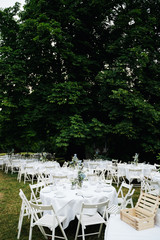 photo of an empty wedding dinner tables in the garden