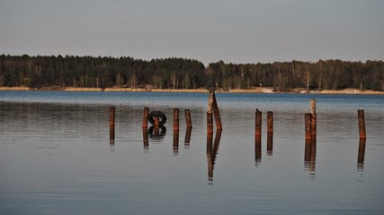 Mooring poles, view of the lake before sunset.