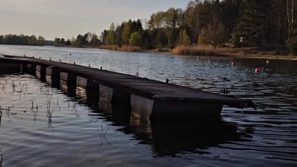 A floating quay on the lake before sunset.
