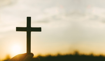 Crucifixion of Jesus christ ,cross with field at sunset.