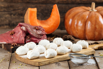 traditional Russian dish of manti dumplings with meat and pumpkin