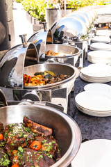 Live food stations. Kitchenware in the line catering summer brunch buffet. Corporate cocktail event