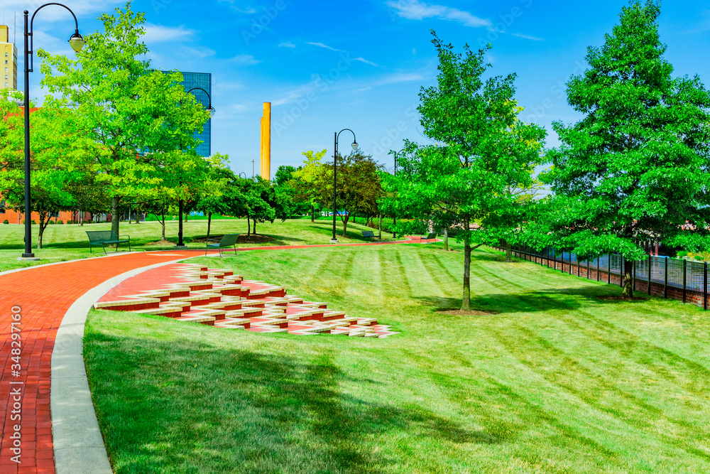 Wall mural Brick path leads through downtown park in Toledo, Ohio