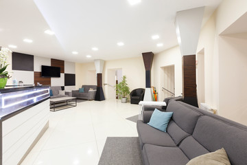 Entrance to the private dentistry, the waiting area and wall with big tv