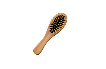 Isolated compact massage hairbrush made of natural wood on a white background.