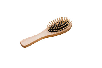 Isolated compact massage hairbrush made of natural wood on a white background.