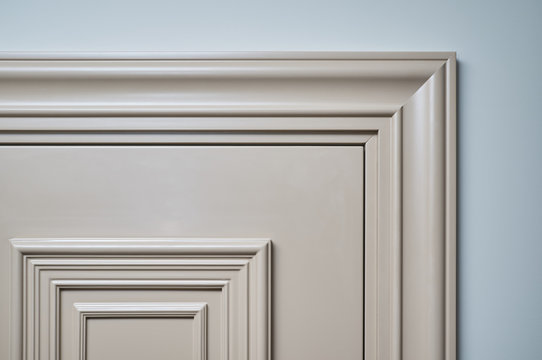classic door with three-dimensional panels and platbands