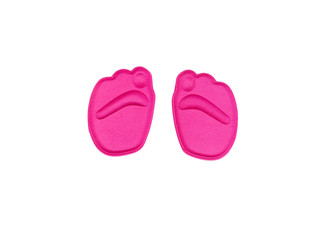 Isolated orthopedic pink insoles on white background. Treatment and prevention of flatfeet and foot diseases. Foot care, feet comfort. Wearing comfortable shoes.