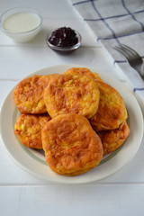 Sweet cottage cheese pancakes on a white plate.