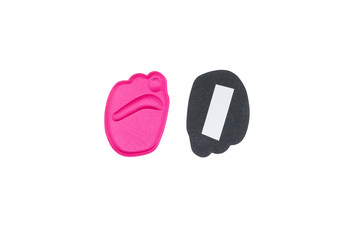 Soft orthopedic insert for the forefoot under fingers in shoes isolated on a white background.