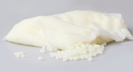 White PET granules, polymer resin, plastic granulate for injection molding process. Plastic pellets. Biodegradable plastic pellets.