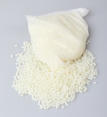 White PET granules, polymer resin, plastic granulate for injection molding process. Plastic pellets. Biodegradable plastic pellets.