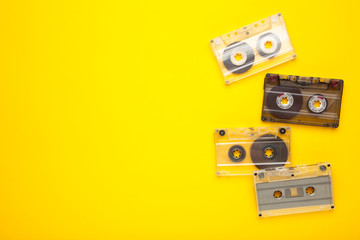 Inscription music day with old cassettes on a yellow background. Music day