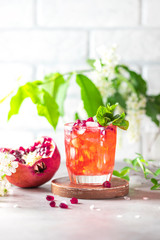 Fresh cold pomegranate lemonade. Homemade lemonade with ice.