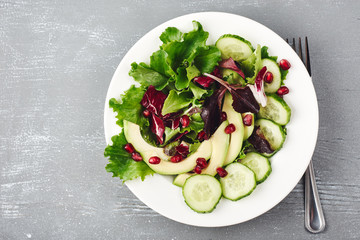 Lettuce salad with cucumber, avocado.