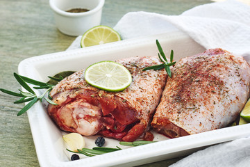 Raw turkey legs with spices.