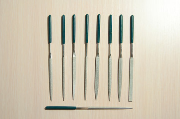 nine files are ready to work. on a wooden background