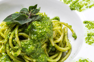 Spaghetti with homemade pesto sauce and oregano