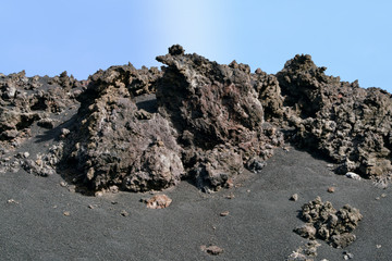 Volcany rocks on black lava