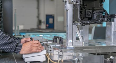 quality engineer controls an instrument for 3D measurement of plastic castings in the automotive industry