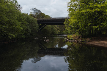 Fototapeta na wymiar Old bridge in a river