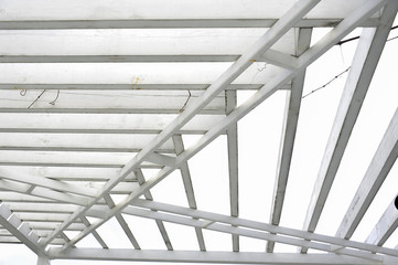 Canopy made of polycarbonate arc. Metal products against the sky