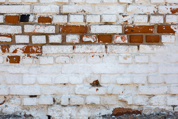 Old red brick  wall with white and red bricks texture, background.