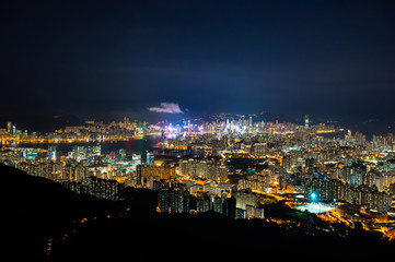 Fototapeta na wymiar panorama cityscape view of Hong Kong at night, the atmosphere of night lights in the city of the harbor, trade, transportation and international export of China