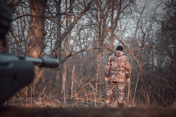 Ambush sniper aims at a man.