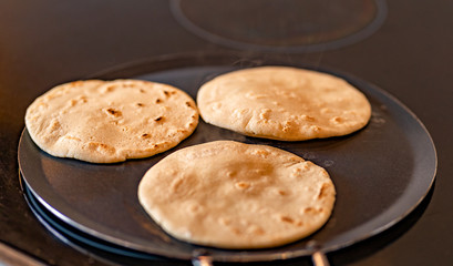 Close up of corn tortillas made in stove