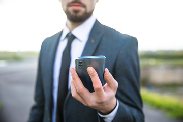 man hand phone in nature