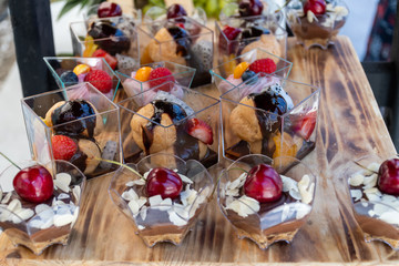 Candy bar food buffet by the pool, during hotel brunch, catering in the garden, food bloggers event