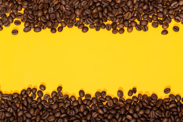 Coffee beans on yellow background. Coffee background border. Copy space